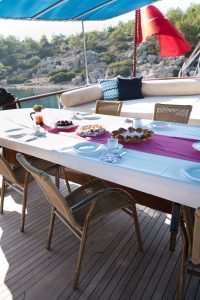 Traditional wooden deck and al fresco dining area on Seven 1