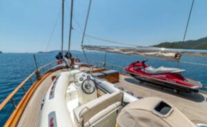 Power boat, water-skis, and water sports equipment ready for charter guests on Sema Tuana