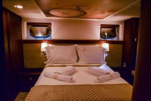 Comfortable and elegant guest cabin aboard Virtuoso luxury gulet
