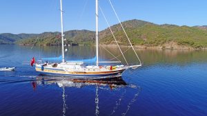 Ece Berrak 33m luxury gulet cruising along the Fethiye coastline