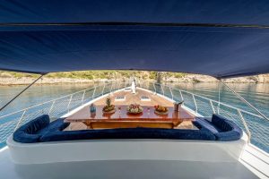 Spacious sun deck and modern outdoor lounge area on Enjoy Life