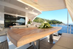 Spacious sun deck and modern outdoor lounge area on Goldfinger