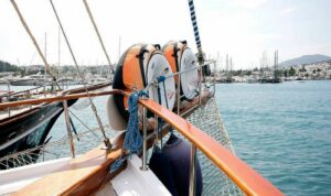 Dinghy, canoes, ringos, and windsurf ready for charter guests on Cemre Junior