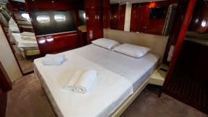 One of the comfortable and spacious guest cabins aboard the motor yacht Bonadea