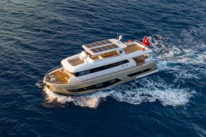 The exterior overview of the twenty-three meter Bay CF Motor Yacht cruising gracefully through the blue waters of Göcek and Mediterranean bays.