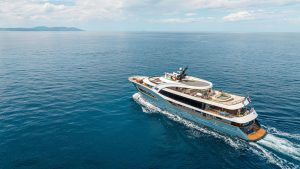 48 meter luxury motor yacht Bella cruising gracefully through the crystal clear waters of the Adriatic Sea in Croatia.