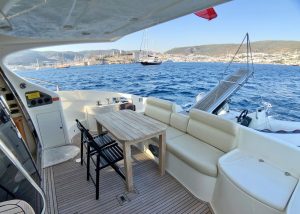 Spacious deck area of the motor yacht Cosmos designed for sunbathing and relaxation