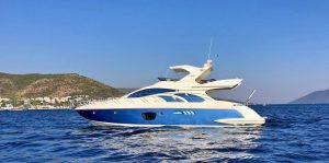 External view of the luxury motor yacht Cosmos cruising off the coast of Bodrum
