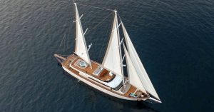 43 meter luxury sailing gulet Love Story cruising majestically with open sails along the stunning Dalmatian coastline in Croatia.