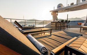 Spacious and luxurious outdoor deck area on motor yacht Zeemar designed for relaxation and enjoying panoramic sea views.