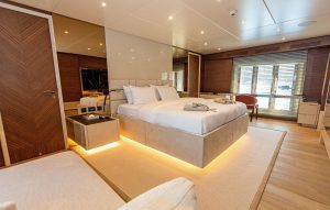 Elegantly styled guest cabin aboard luxury motor yacht Zeemar featuring premium bedding and contemporary interior finishes.