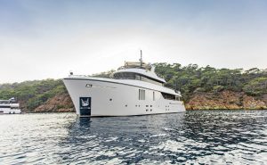 30 meter luxury motor yacht Zeemar cruising gracefully through crystal clear waters with a sleek and modern design.