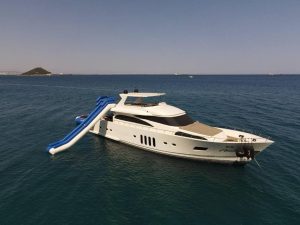 Luxury motor yacht Amolia cruising gracefully in the crystal-clear turquoise waters of Turkey.