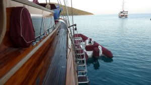 Luxury private charter gulet Il Fratello cruising on the turquoise sea