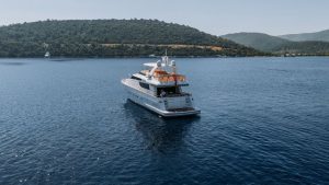 KUUM Motor Yacht 3 Exterior view of the 22.78-meter luxury charter motor yacht M/Y KUUM cruising off Bodrum