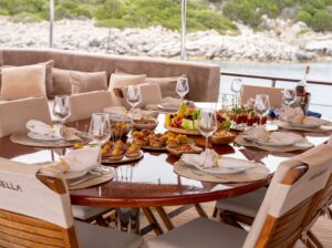 Gulet ARABELLA 3 Gulet Arabella aft deck outdoor dining area Luxury gulet Arabella forward deck sunbathing cushions Bodrum yacht charter Arabella alfresco dining experience
