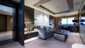Spacious master suite stateroom with panoramic ocean views on luxury yacht Artisan.