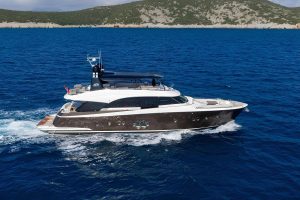 Exterior view of the 26.3-meter Bella Luna luxury motor yacht cruising through the crystal-clear waters of Gocek.
