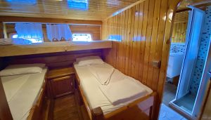 Interior design of a spacious double cabin with air conditioning and private bathroom on the fully refitted luxury gulet Bluefest.