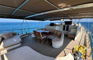 Double bed and modern wooden interior decoration inside the spacious master cabin of luxury gulet Little Gulmaria