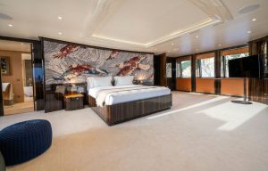 Luxurious master suite cabin inside the M/Y Starlust superyacht with modern interior design