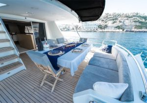 Al fresco dining and sunbathing deck space on motor yacht Bige Derin