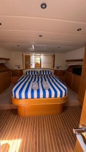 Luxurious master and guest cabins accommodating up to 6 guests on Guy Couach yacht.