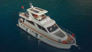 Vera 34 luxury motor yacht cruising in the crystal-clear waters of Gocek, Turkey.