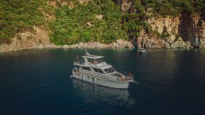 Vera 34 luxury motor yacht cruising in the crystal-clear waters of Gocek, Turkey.